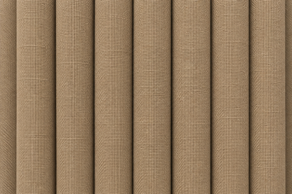 Close-up of a woven fabric texture in a warm tan or beige color, shown with vertical folds.