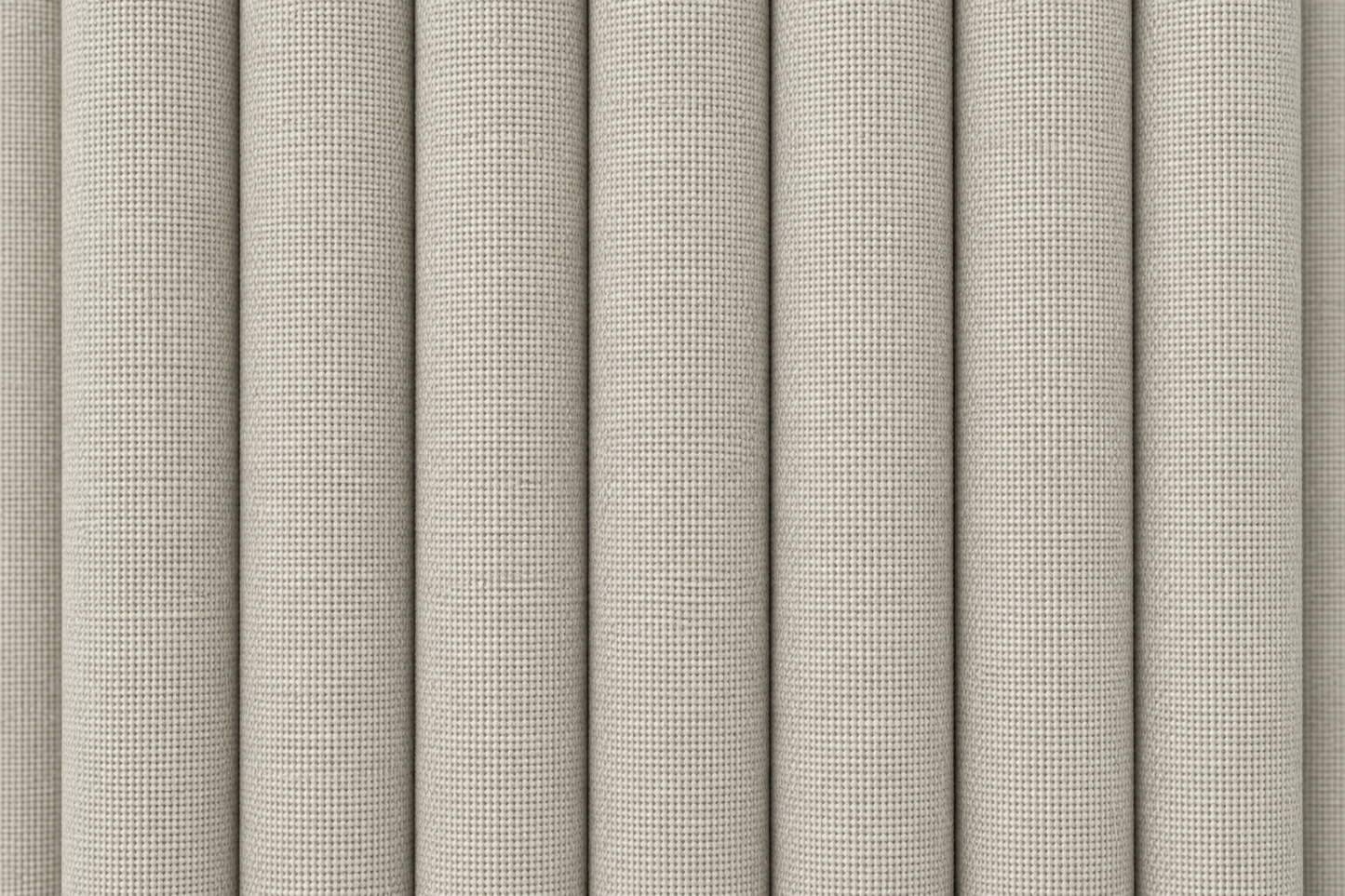 Close-up of a light beige woven fabric or wallpaper texture shown in vertical rolled panels.