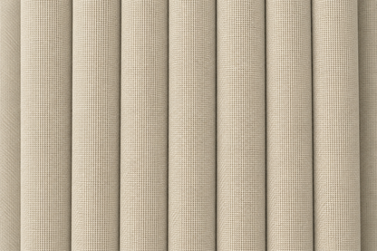 Close-up of a beige woven fabric with a textured basketweave pattern, shown in vertical folds.