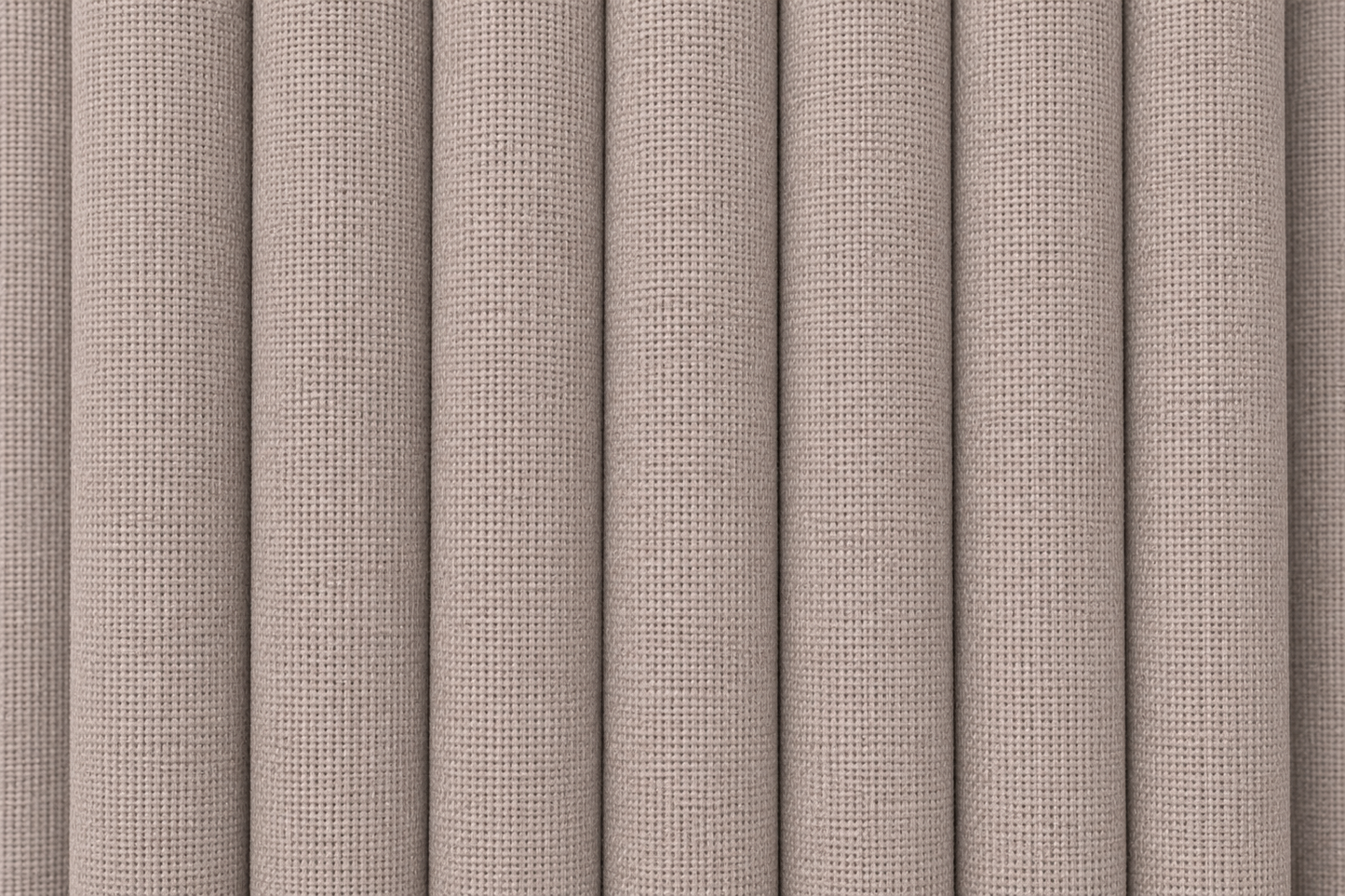 Close-up of a textured fabric or wallpaper pattern with vertical pleated folds in a warm taupe-beige color.